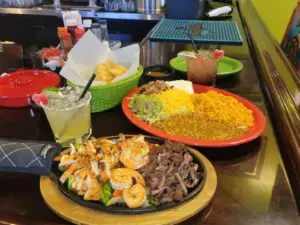 fajitas with rice, beans, tortillas, and margarita